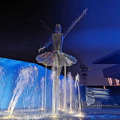 Large stainless steel character shaped outdoor sculpture in the park